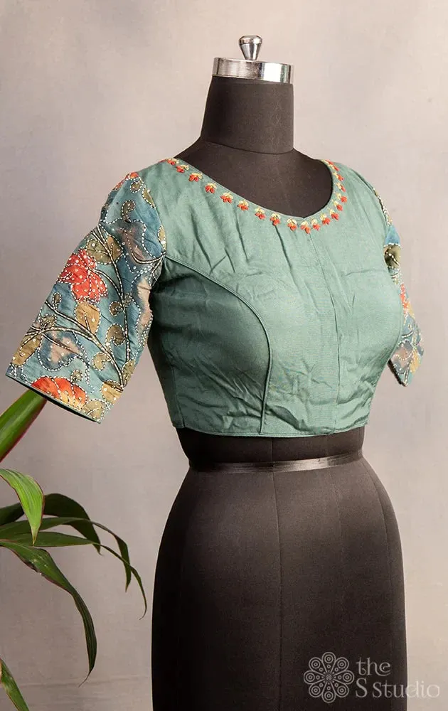 Pastel green embroidered silk blouse with kalamkari hand painted sleeves